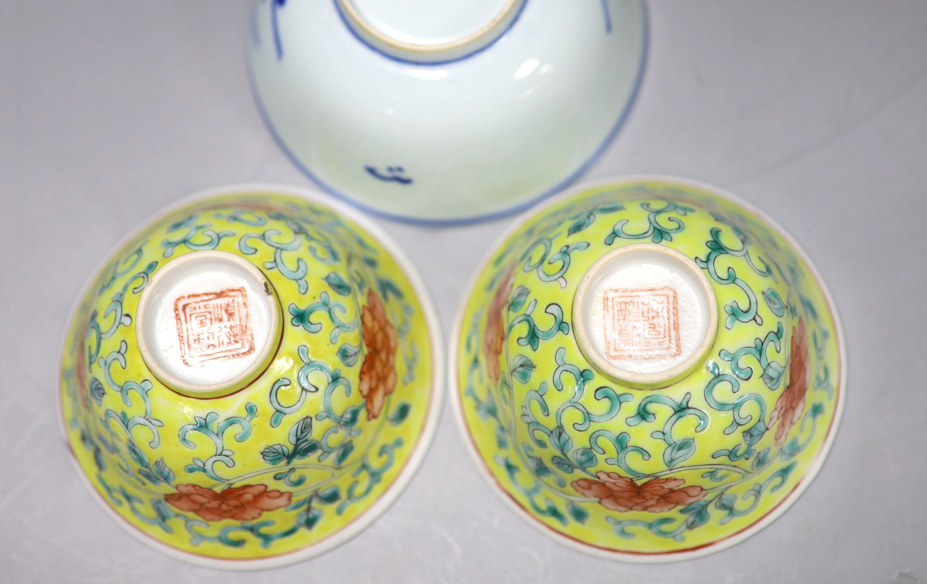 A group of Chinese porcelain, 19th /20th century, to include a pair of yellow ground bowls, 10.8 cm diameter, a blue and white vase, Xuande mark, a similar bowl and vase, and a champleve enamel bronze koro and cover